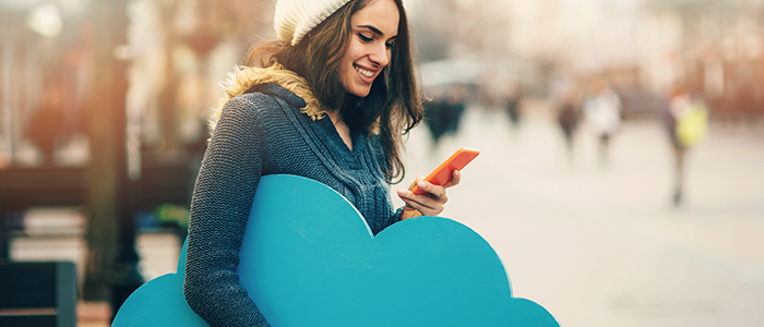 woman holding cellphone and blue cloud